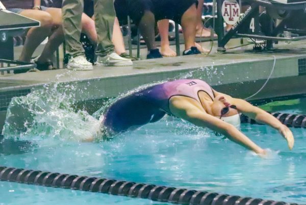 Nam Anh Truong '26 launches into her backstroke race with determination, her body arching gracefully as she enters the water during the historic meet. "The energy was really exciting," Truong said. "I was really proud of us because, [even though] we have won in previous years, the competition was harder this year so our victory was surprising in a nice way."