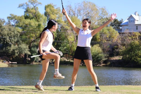 On the back nine, Riley Muljadi '28 and Jordyn Choe '27 celebrate with their clubs in the air. Completing the tournament with their friends gave the golfers a chance to have fun in between hitting.