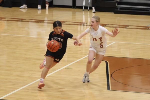 In the first half of the game, Evelyn Bell '28 attempts to block a Hippo. The Warriors remained tied with the Hippo until the fourth quarter, when the Hippos surged ahead to win by a handful of points.