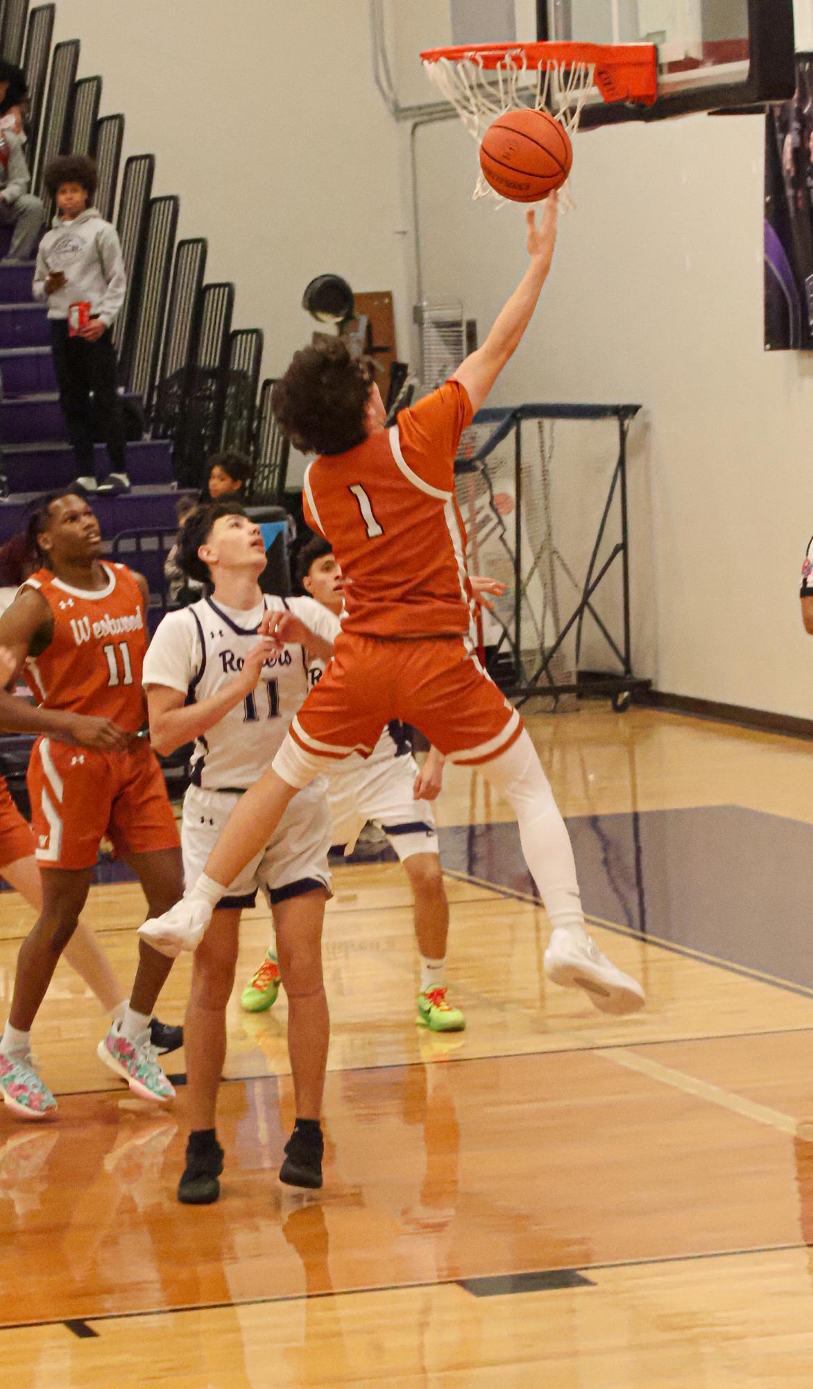 GALLERY: Varsity Boys Basketball Dunks on Cedar Ridge, Winning 63-40