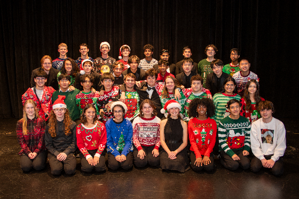 Posing for their senior photo, the Westwood Band members come together for their final holiday concert. The holiday concert was put together in three weeks after a quick turnaround from marching season.