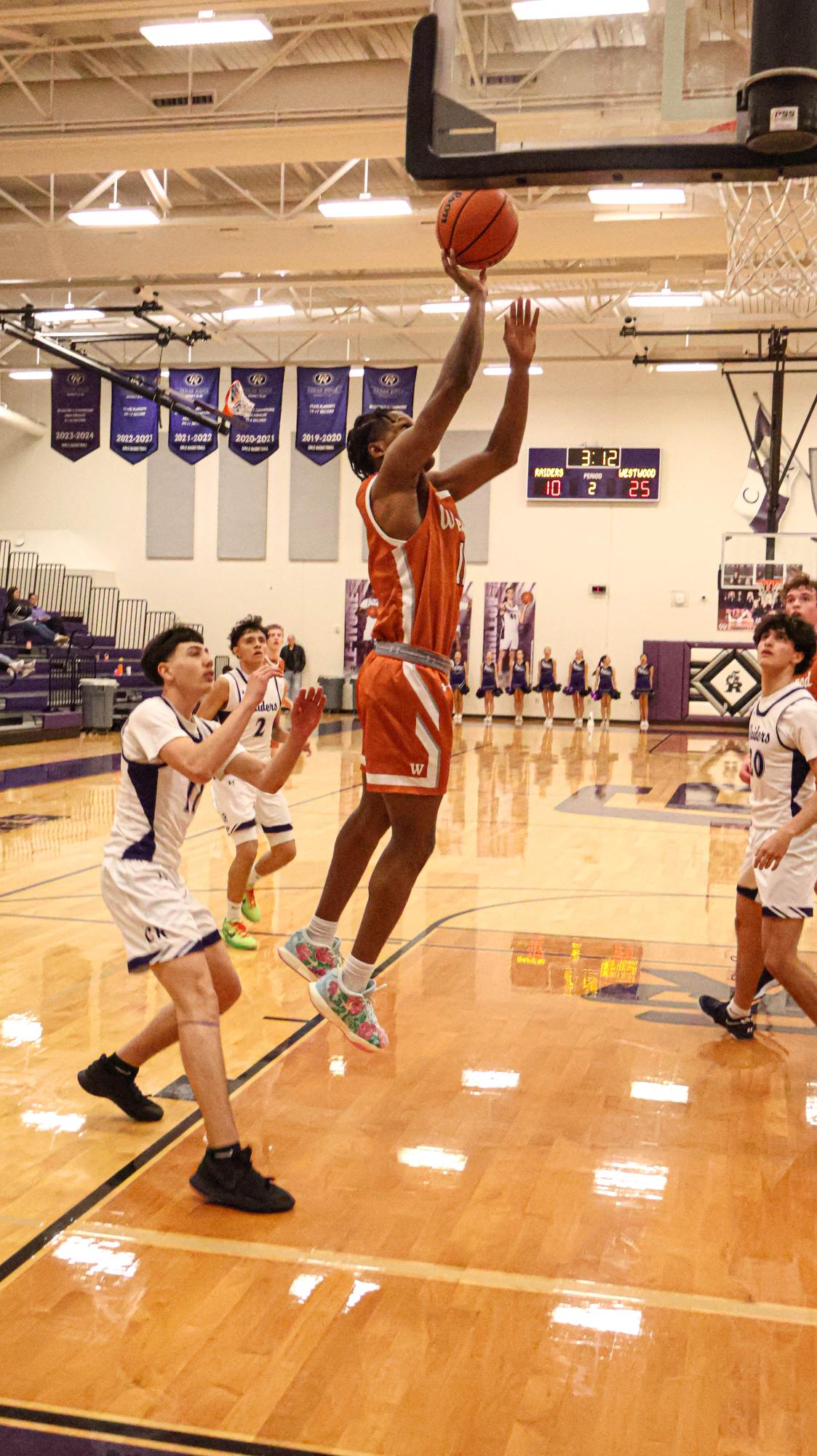 GALLERY: Varsity Boys Basketball Dunks on Cedar Ridge, Winning 63-40