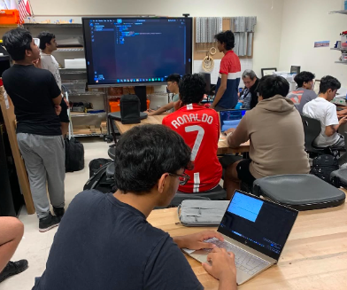 As Sambit Kanjilal '25 walks through how to code a solution to a practice problem, members follow along. The club members prepared for the upcoming USA Computing Olympiad contest in December. "People are going to have to develop their thinking a lot, and it's going to be hard for them because some of these people have no experience," Computer Science Club President Arjun Bhardwaj '25 said. "We'll be teaching a lot more on how they can develop their skills."
