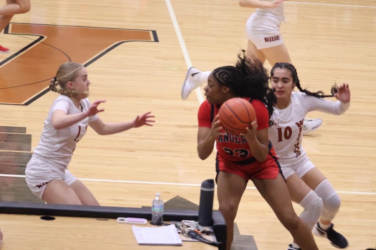 Working together, Co-Captain Theresa Bell '26 and Bella D'Alessandro '25 close in on the ball. Team chemistry was an important aspect of the team's collaboration throughout the game. "We've really improved on talking with each other and trusting each other," D'Alessandro said. "I think that comes over time, with team building and just hanging out with each other."