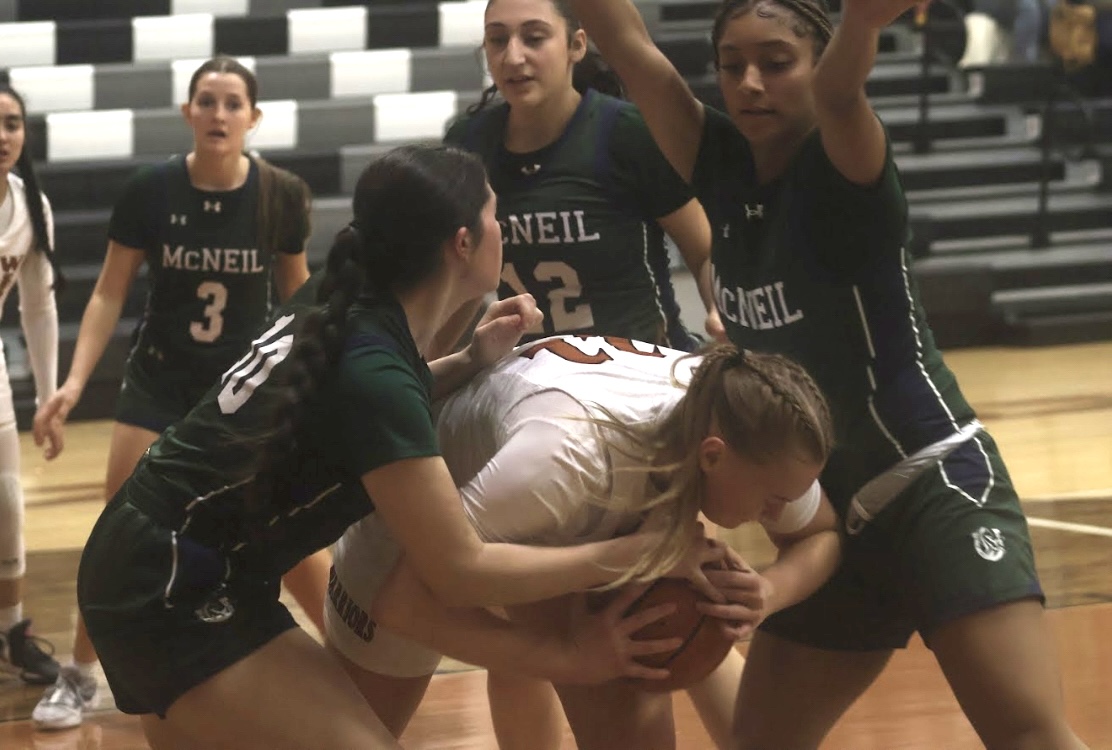 Co-Captain Caroline Doughtery '25 holds on to the ball. The Warriors fought back against McNeil's defense, maintaining their communication throughout the game. "This [win] feels really good," Head Coach Kelli Payton said. "It was big for us because we're still in the playoff hunt, and so getting another win just puts us in a good position to hopefully extend our
season."