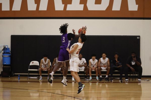 Bryan Li '28 blocks a pass by Cedar Ridge as his teammates and coach watch on, allowing for Westwood to get a crucial possession in the endgame. In the final quarter, Westwood's possessions dwindled and of the few they got, even fewer resulted in them scoring.