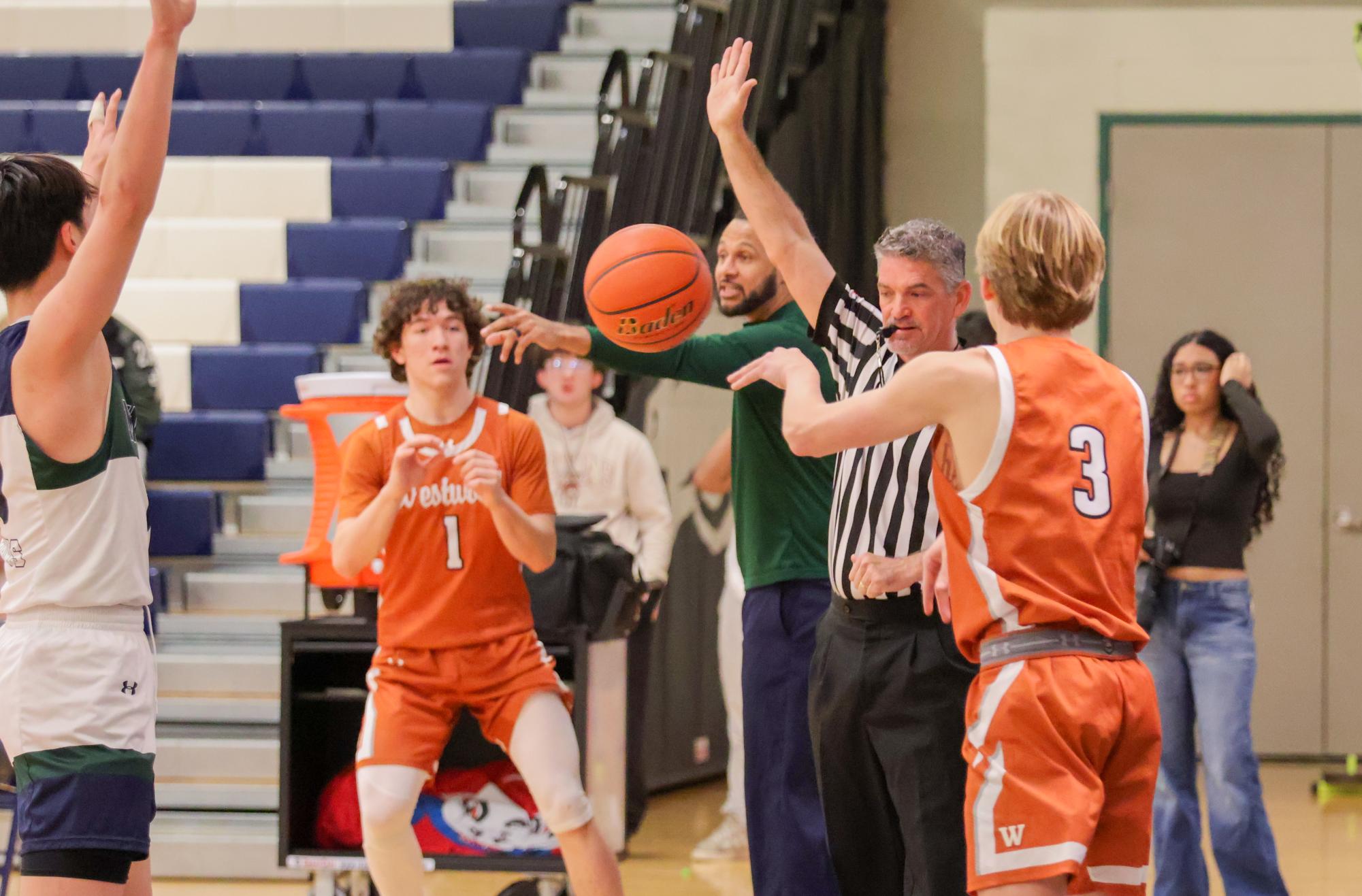 GALLERY: Varsity Boys Basketball Dunks on McNeil