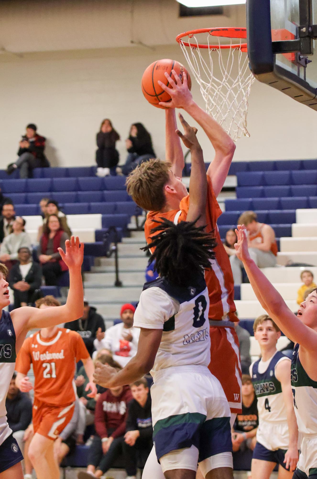 GALLERY: Varsity Boys Basketball Dunks on McNeil