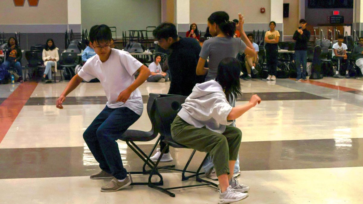 As the intense music pauses, members rapidly find a seat for survival. The last game of the was musical chairs, similar to the last game 'Mingle' from the Squid Game series.