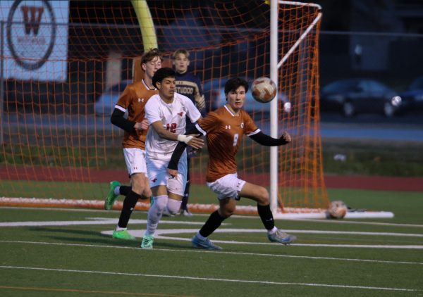 Putting as much distance between himself and the goal as possible, Caleb Fagan ‘25 tries to find an exit. As the game progressed, it became more physical.