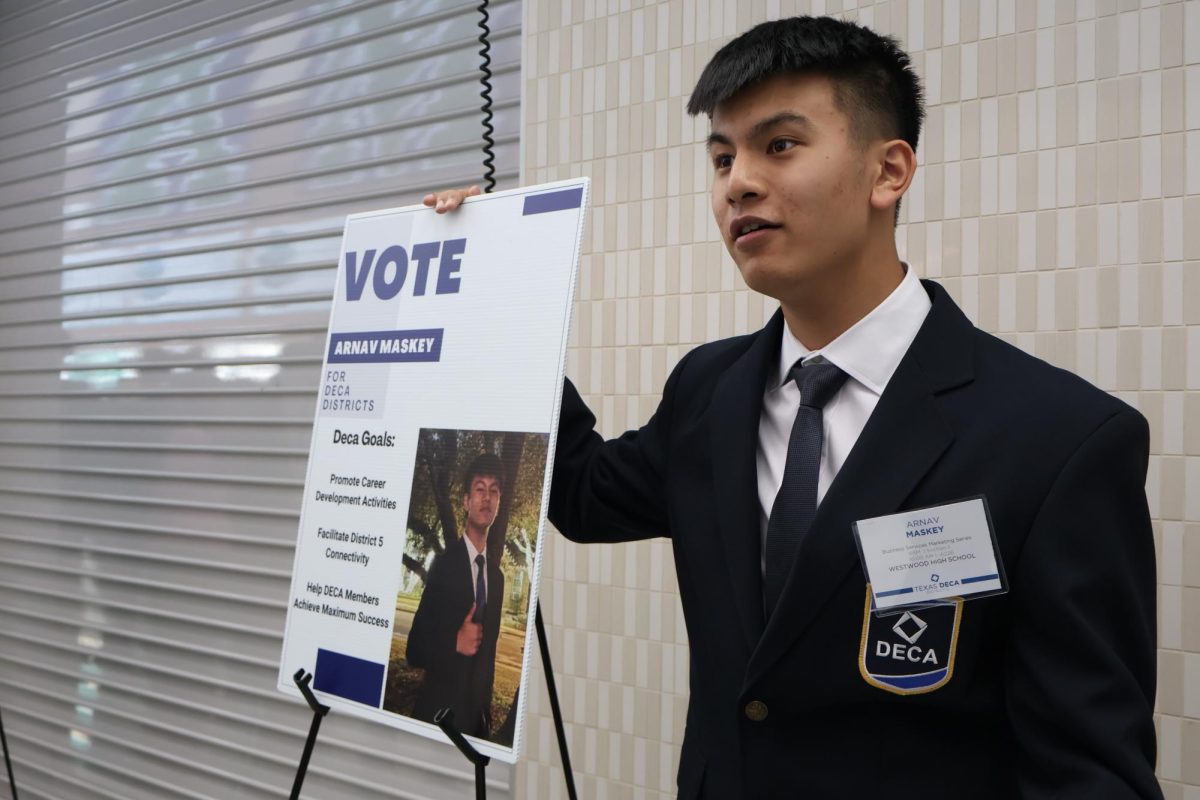 Engaging in the conference's meet and greet with district officer candidates, Arnav Maskey '26 eagerly explains his aims for the upcoming year if elected. At the end of the conference, Maskey was voted the new vice president for the district. 