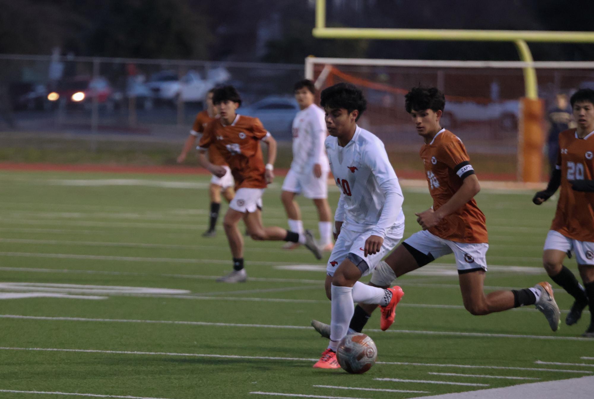 Varsity Boys Soccer Deconstructs the Manor Mustangs 3-2 in Third District Game