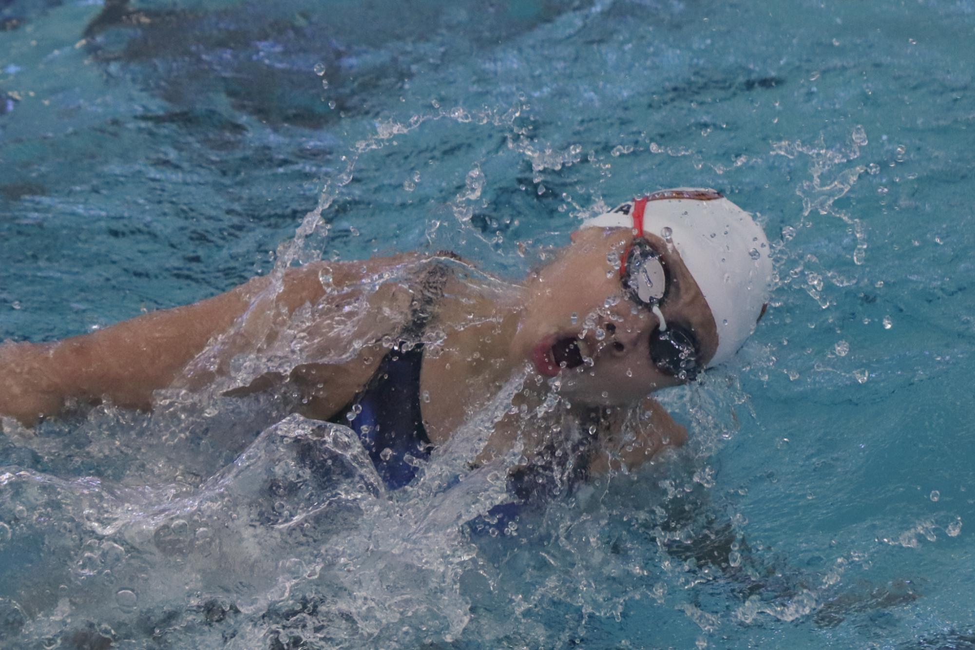 Six and Swimming: Warriors Rule Again at District Championships