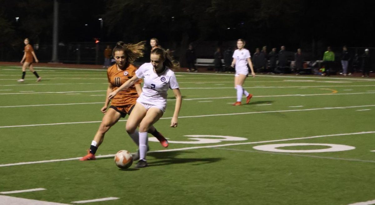 Applying pressure to get the ball back, Mia Wiele '26 attempts to get the ball back after Westwood turns it over. Westwood holds possession of the ball during most of the game against Cedar Ridge.