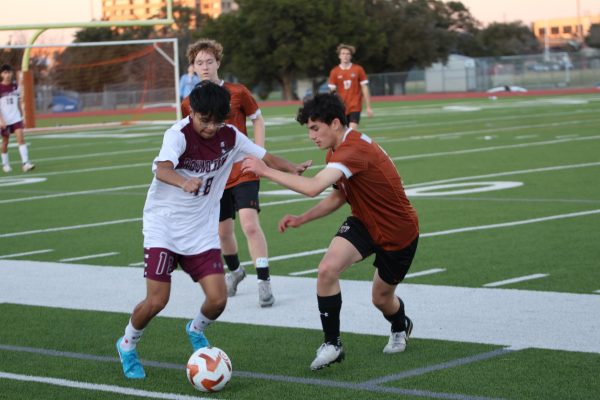 In an attempt to steal the ball, Lucas Carlos '27 blocks a Dragon's path. He would prove essential to making breakthroughs through the Round Rock defense lines.