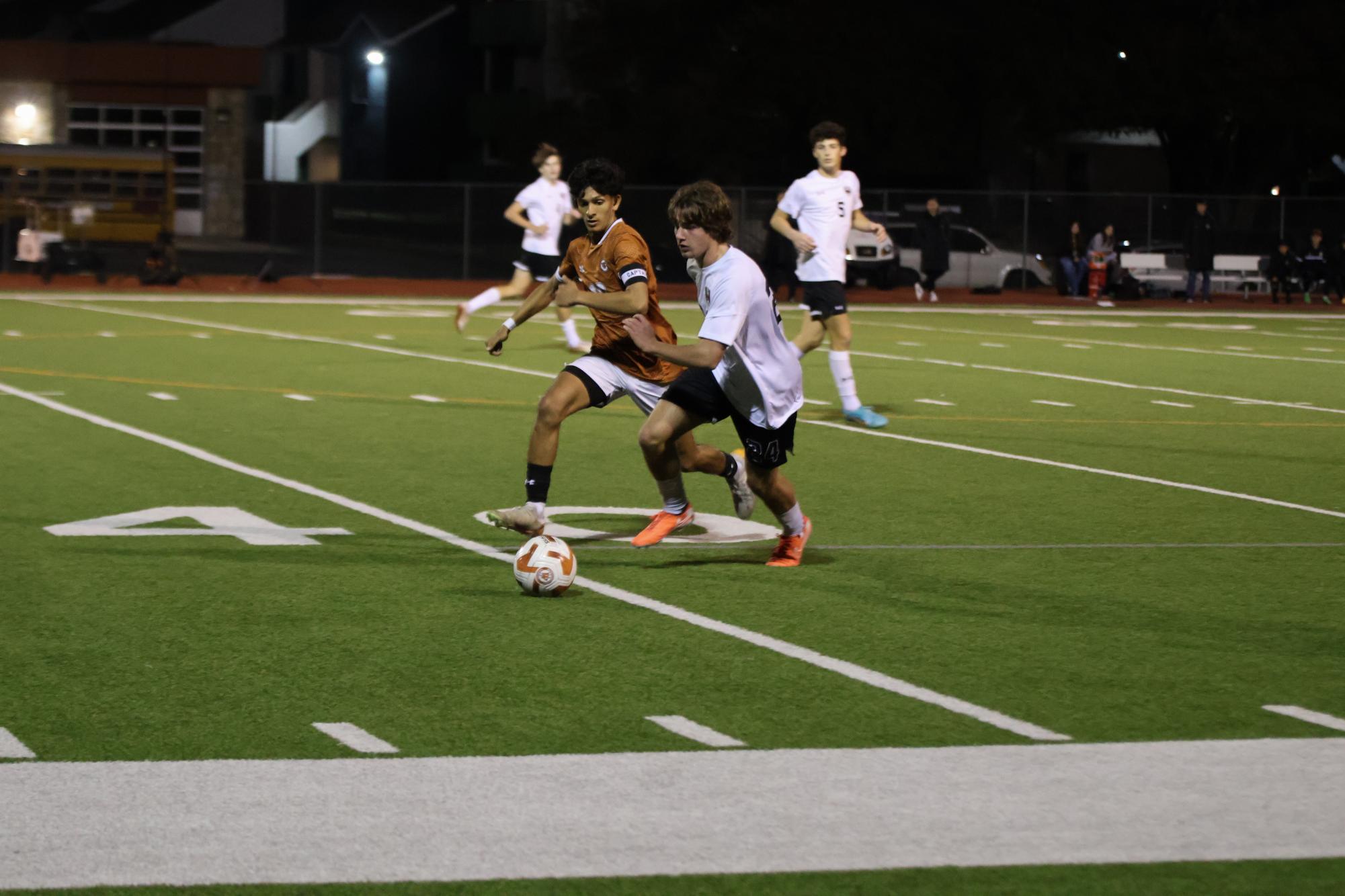 Varsity Boys Soccer Ties Intense Game Against Dragons