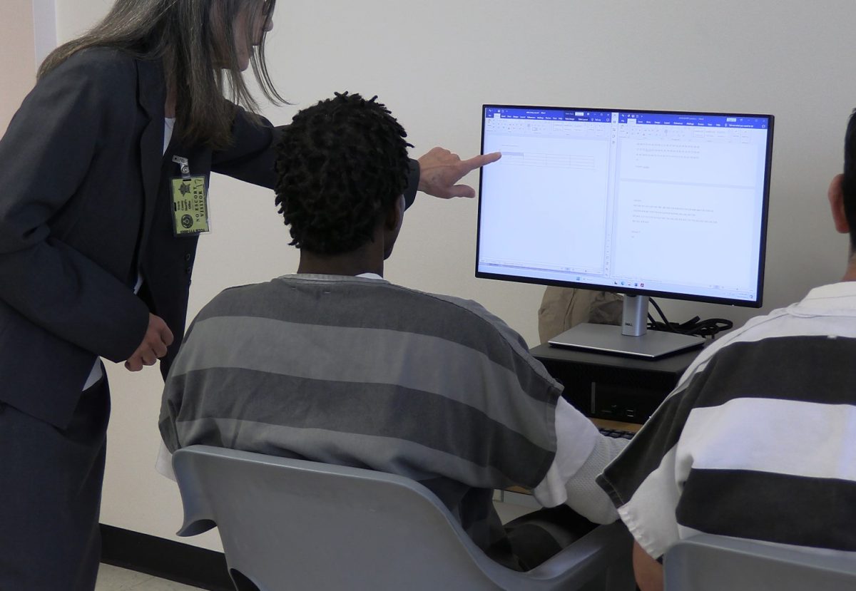 Teaching Travis County Correctional Complex inmates, members of Austin Community College and Travis County Sheriff's Office collaborate to help answer questions. Starting in October, teachers have held weekly sessions with inmates to develop new skills needed in an increasingly digital world.