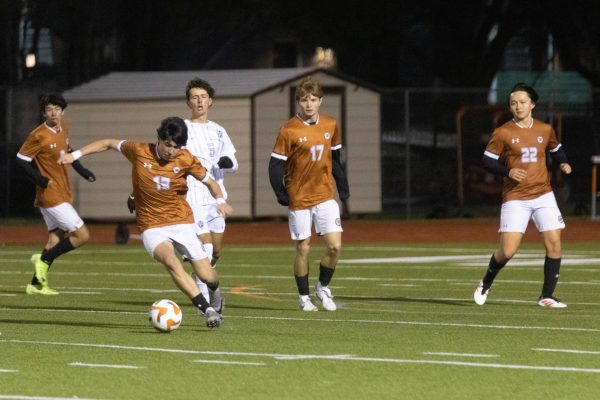 With teammates close behind, Santiago Peña ‘27 takes possession of the ball. The team used communication on the field to ensure they stayed ahead of the Raiders.
