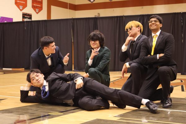 After the intermission phase, the contestants walk out from the black drapes and pose. Starting the formal wear stage of the pageant, seniors Ian Shone, Austin Barrois, Kaya Chen, Steven Ma, and Hrithikesh Panda all dress their best.