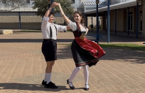 Celebrating Geman folk culture, Gabriel Oliveira '25 twirls Ellah Daniel '29 during their German partner dance. Both dancers competed at Sprachfest, a regional competition on Feb. 8, and then advanced to TGSC which took place in March.