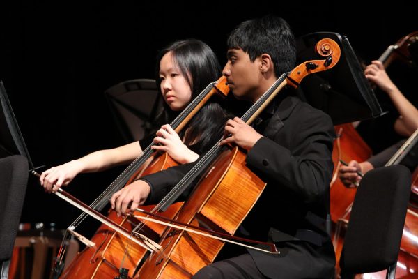 Attention on the music, cellist Vasin Sannareddy '26 moves in unison with the rest of his section. Symphony Orchestra ended the night with a powerful ending for each piece, making the concert a memorable experience.