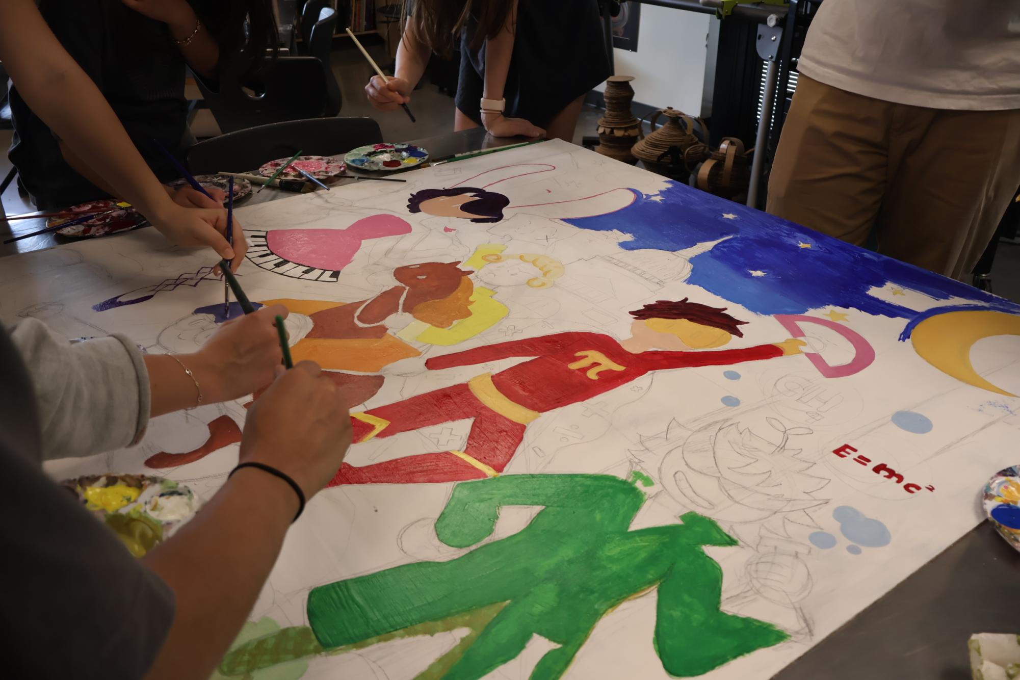 NAHS Paints Teacher Appreciation Mural and Save Soil Backdrop