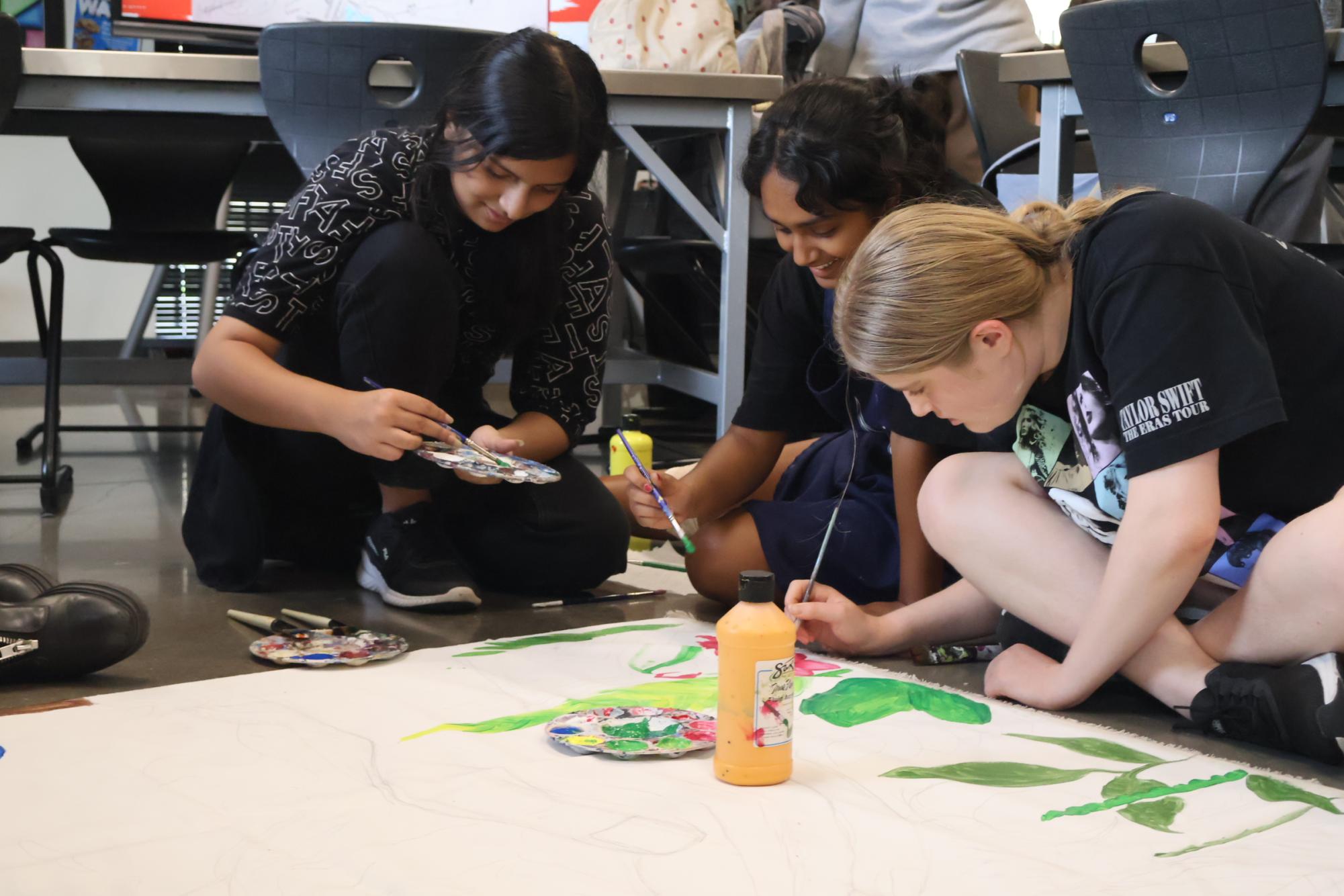 NAHS Paints Teacher Appreciation Mural and Save Soil Backdrop