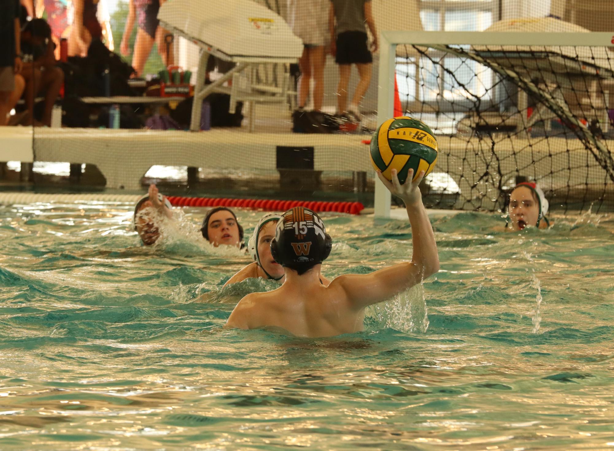 Readying to attempt a goal, Asher Montgomery '29 works to keep the ball away from the McNeil Mavericks. The Warriors had a bold strategy, attempting as many goals as they could. 