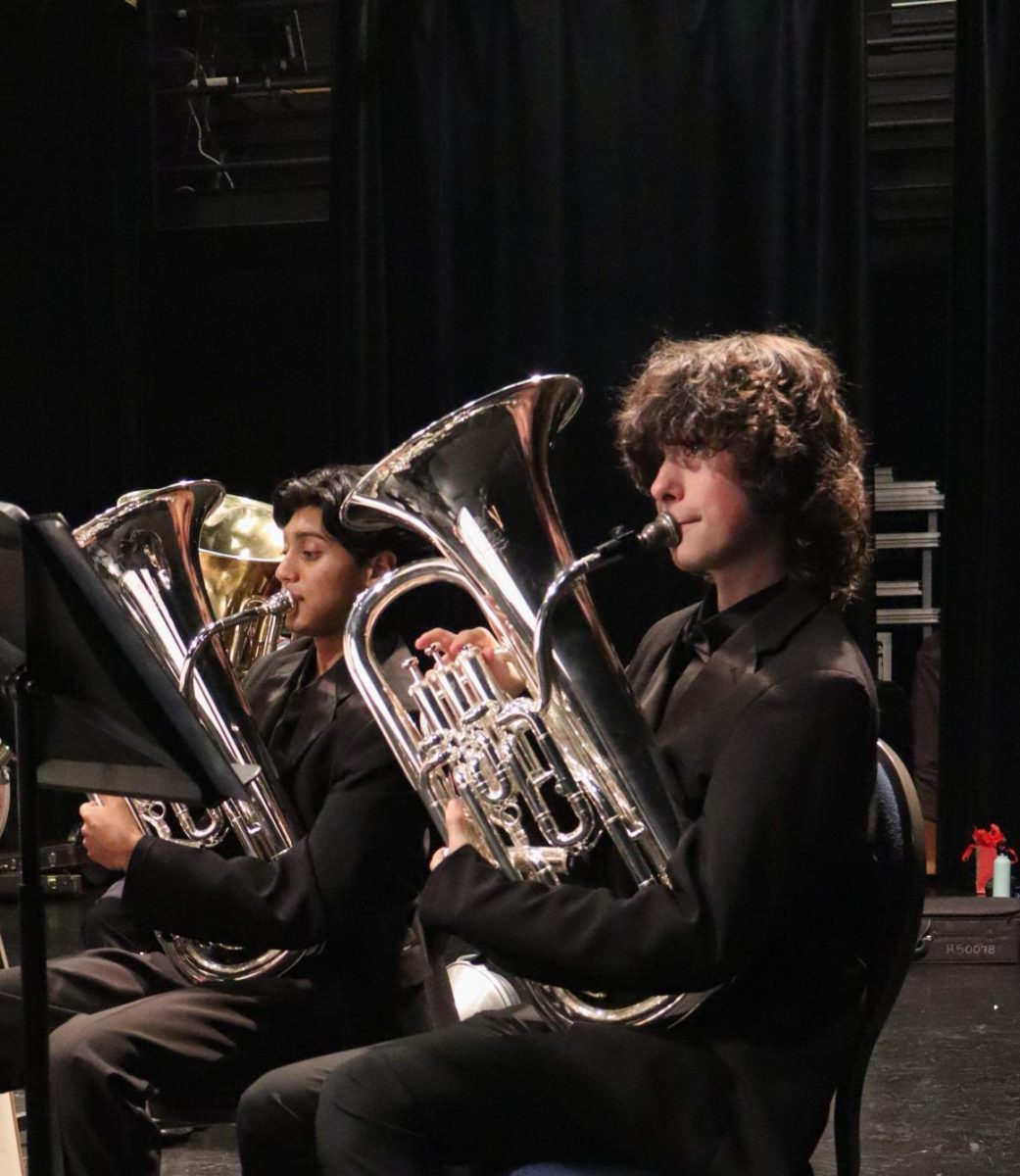 Warming up his euphonium, Brody Jones '28 practices his music before the concert begins. Each band had a chance to warm up together before heading to the stage to perform.