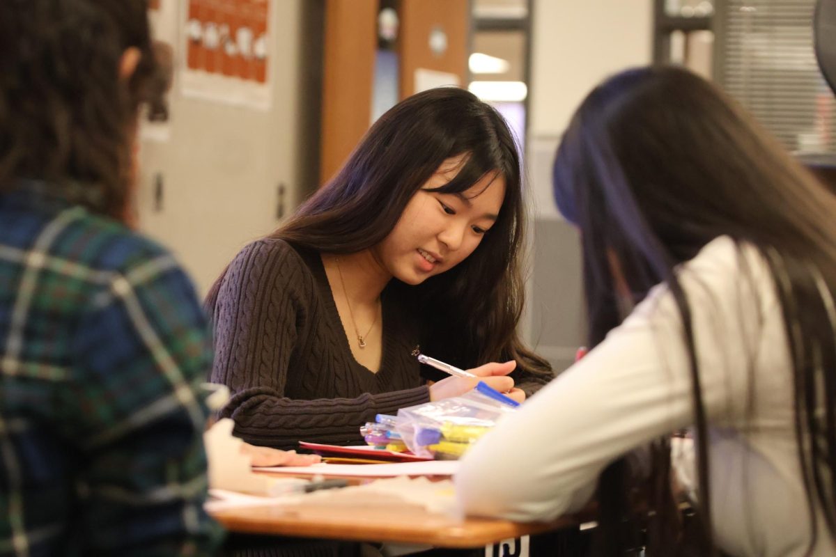 Decorating diligently,  Haruna Kubo '26 channels her creativity into a personalized card. Kubo's main goal of these cards was to spread kindness to children living with rare or undiagnosed diseases. Once finished crafting the cards, The Psychology Club plans to deliver them to the children.
