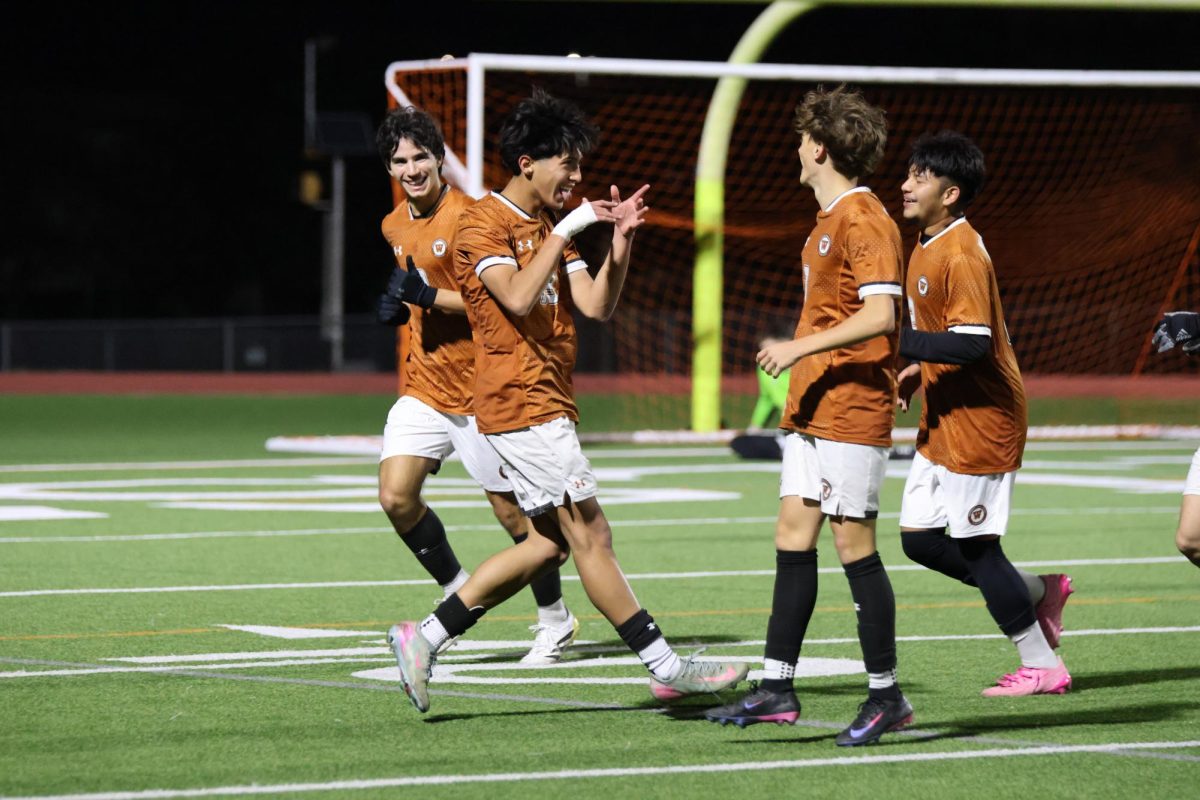 Running towards his friends, Santiago Pena '27 celebrates after scoring the second goal of the game. Pena was the MVP of the game.