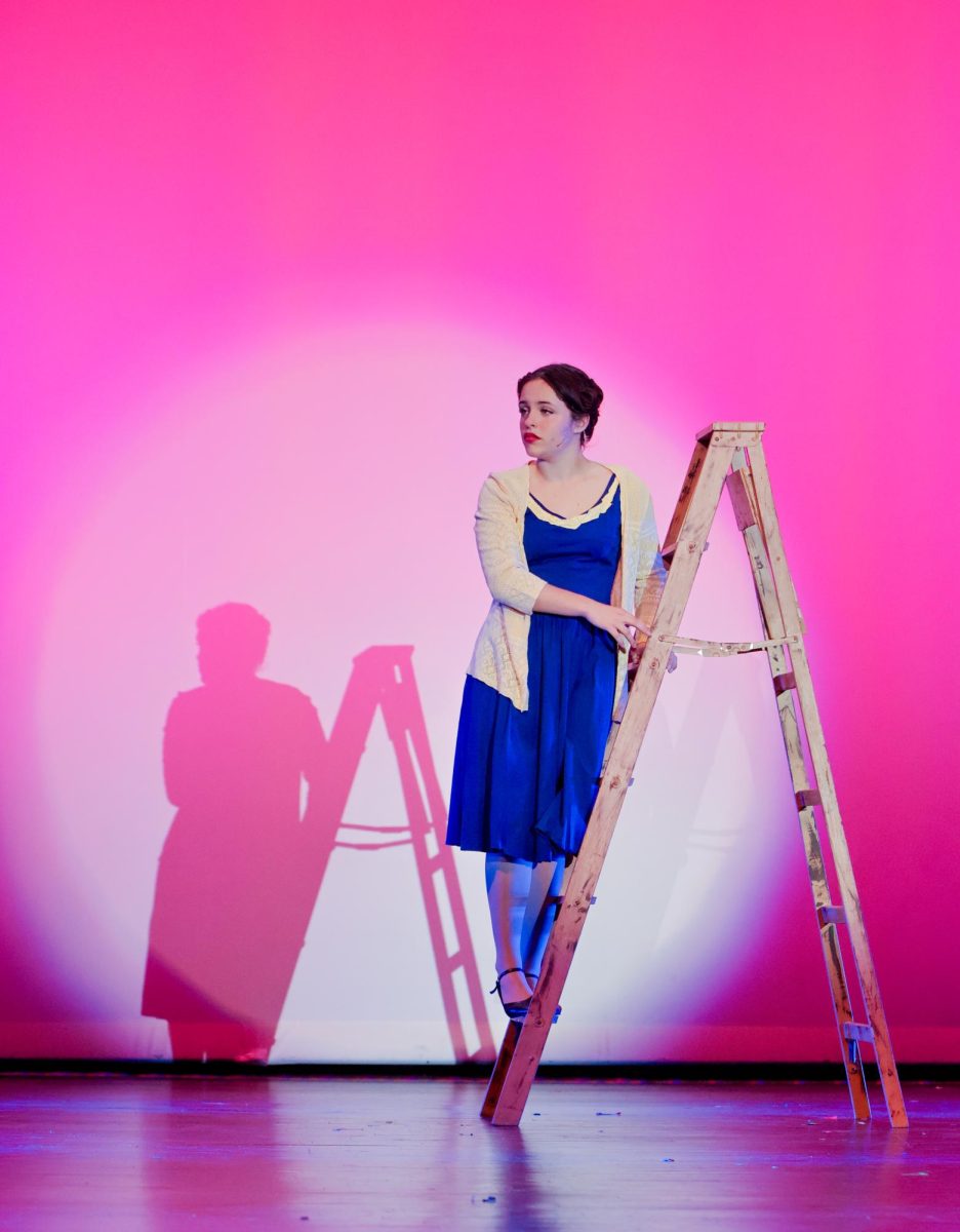 Gazing into the distance, Maddy Ziegler '27 as Kathy Selden awaits Don Lockwood's confession of love. The two characters have a 'will-they, won't-they' romance in Act One of the show. 