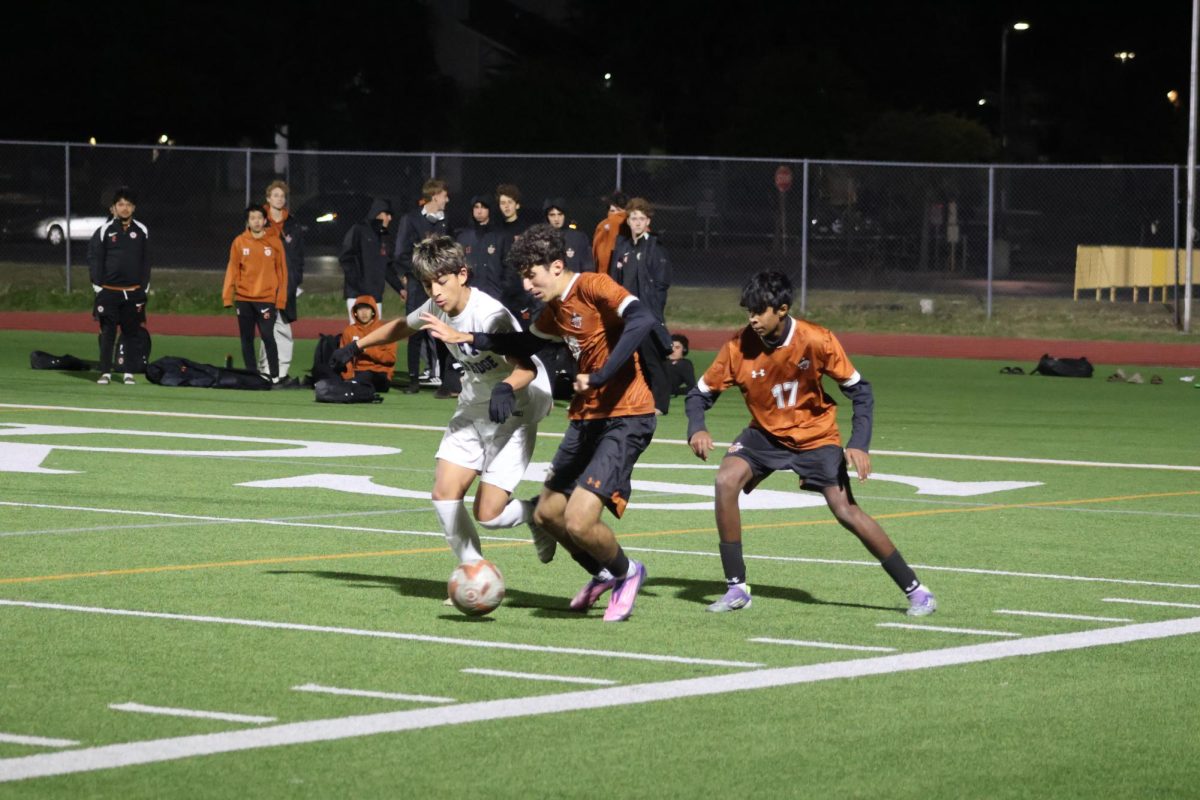Fighting through pressure, Raman Mojtahed ‘28 challenges for teh ball and works to regain possession for the Warriors. His effort helped disrupt Cedar Ridge’s attack and keep play competitive in midfield.