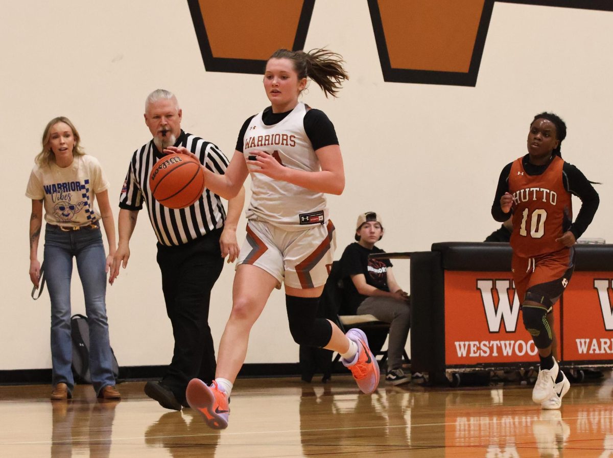 After getting a steal, Aubrey Rose Lawrence '29 drives toward the basket. 