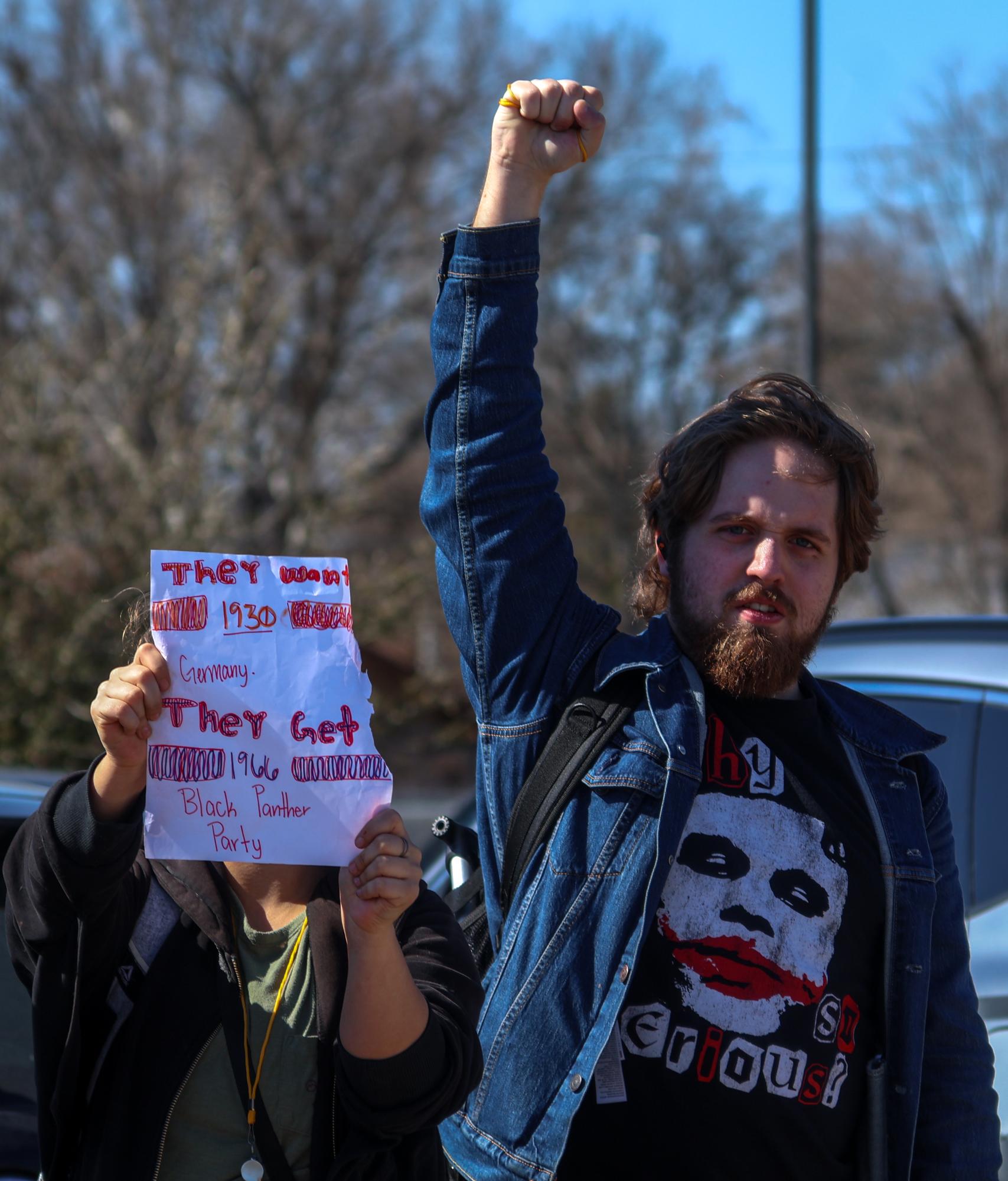 Determined, Dez Wilson '26 throws his fist up into the air, a symbol of the Black Panther Party. The Black Panther Party was a revolutionary organization, active during the late 1960s, that aimed to achieve equal rights for the African-American community.