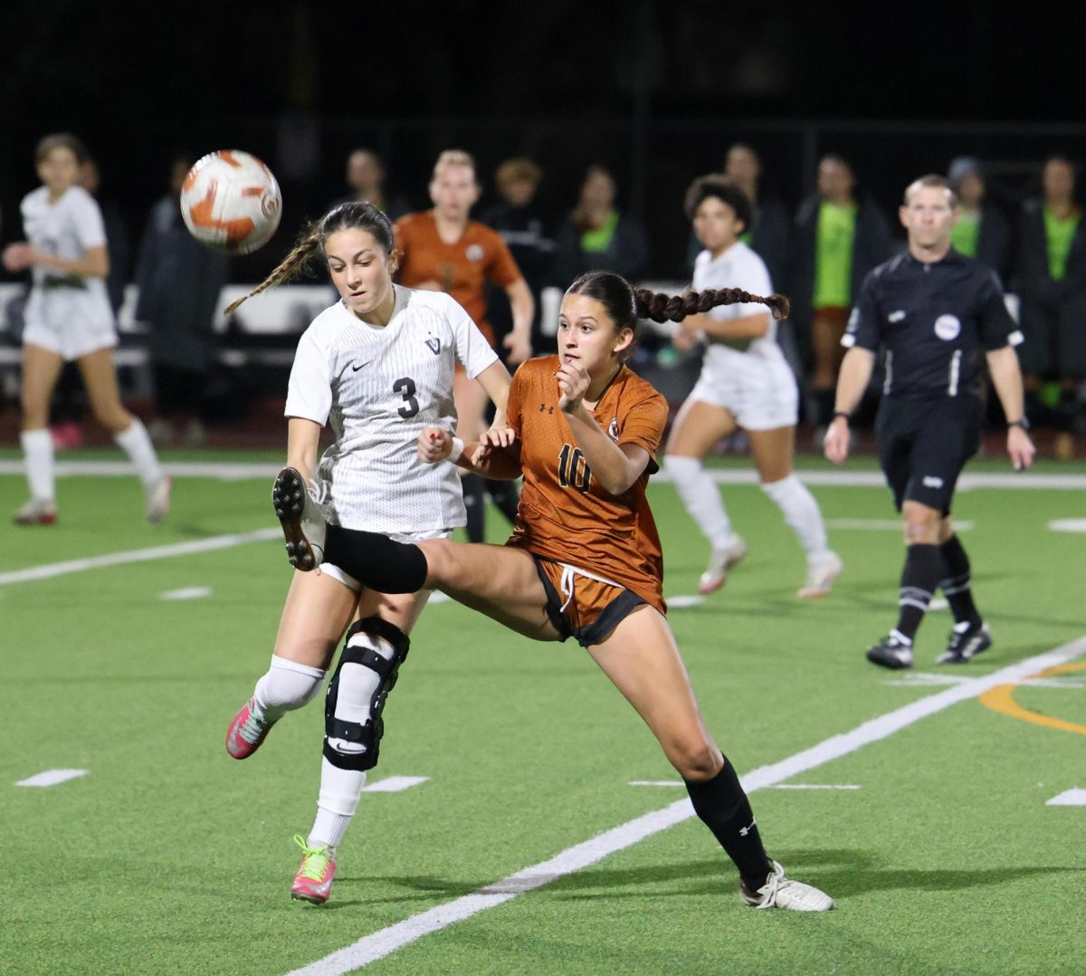 A leg up Jaelynn Soliis '27 knocks the ball out of the way from a Vandegrift Viper. Both teams were very fierce and it was an intense matchup.