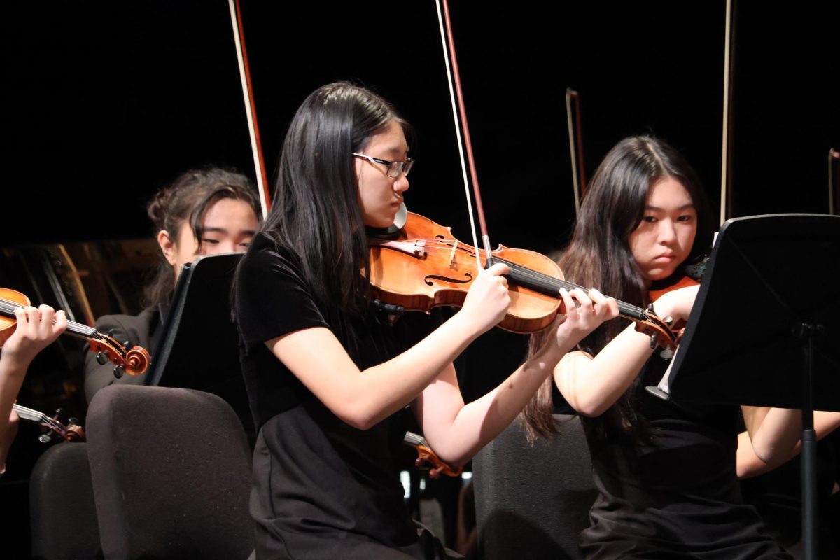 Focusing on their technique, seniors Evelyn Liu and Haruna Kubo perform at the TMEA Send-Off Concert at the PAC. This concert served as a final preparation before the Full Orchestra's appearance at the state convention. 