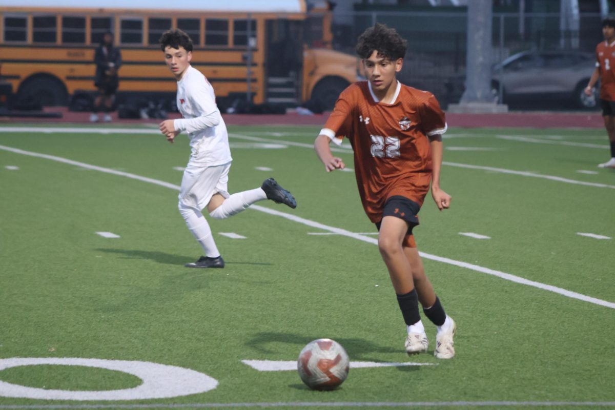 Pushing the ball, Diego Garcia ‘29 moves the ball away from the Warrior goal. Even after scoring the first goal, the Warriors continued the pressure on the Mustangs in attempts of scoring another goal.