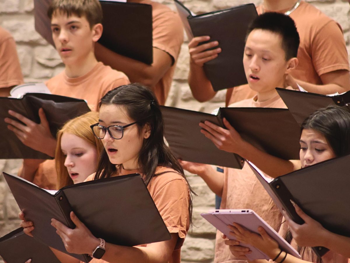 Loud and proud, Ana Jovanovic '27 sings out during the Chamber performance at the MADS Fest Preparatory Concert. Singers worked each part and every block of choir in order to properly master the music for the concert.