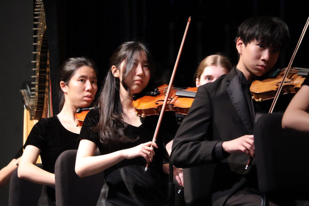 Focused, Diane Kim '28 looks up to follow the conductor at the UIL Preview Concert on Feb. 27. This concert gave the full orchestras an opportunity to perform before the actual UIL evaluation.