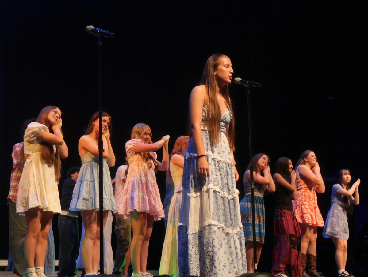 Kate Hammonds '27 haunts the crowd with a beautiful solo to end Chambers rendition of I'm Gonna Be (500 miles) by the Proclaimers. The performances also included solos within each song.