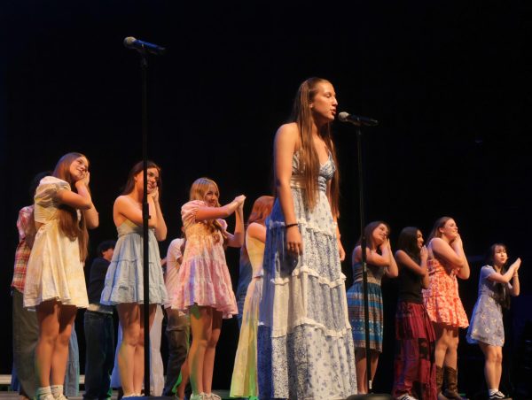 Kate Hammonds '27 haunts the crowd with a beautiful solo to end Chambers rendition of I'm Gonna Be (500 miles) by the Proclaimers. The performances also included solos within each song.