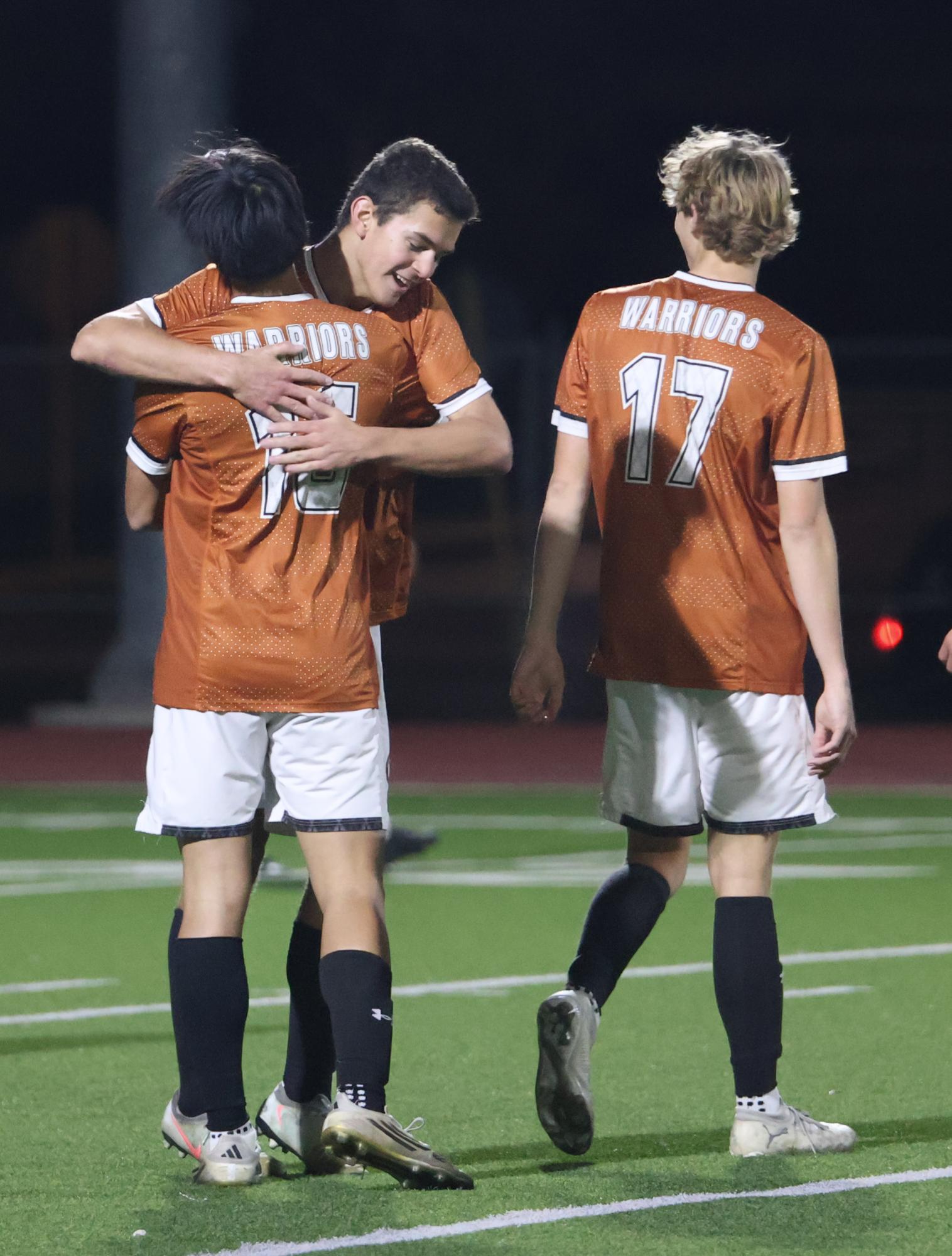 Hugging a teammate, Charles Walker '27 celebrates a goal. As team captain, Charles made it a goal to encourage his team and always push them to be their best.